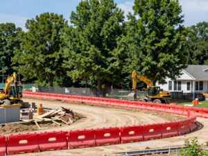 Construction site in Plymouth MI with tree protection barriers around healthy trees