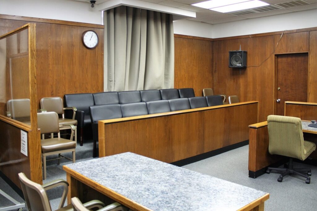 Jury box with rows of chairs in a courtroom