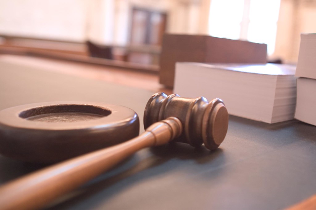 Judge's gavel on a wooden desk